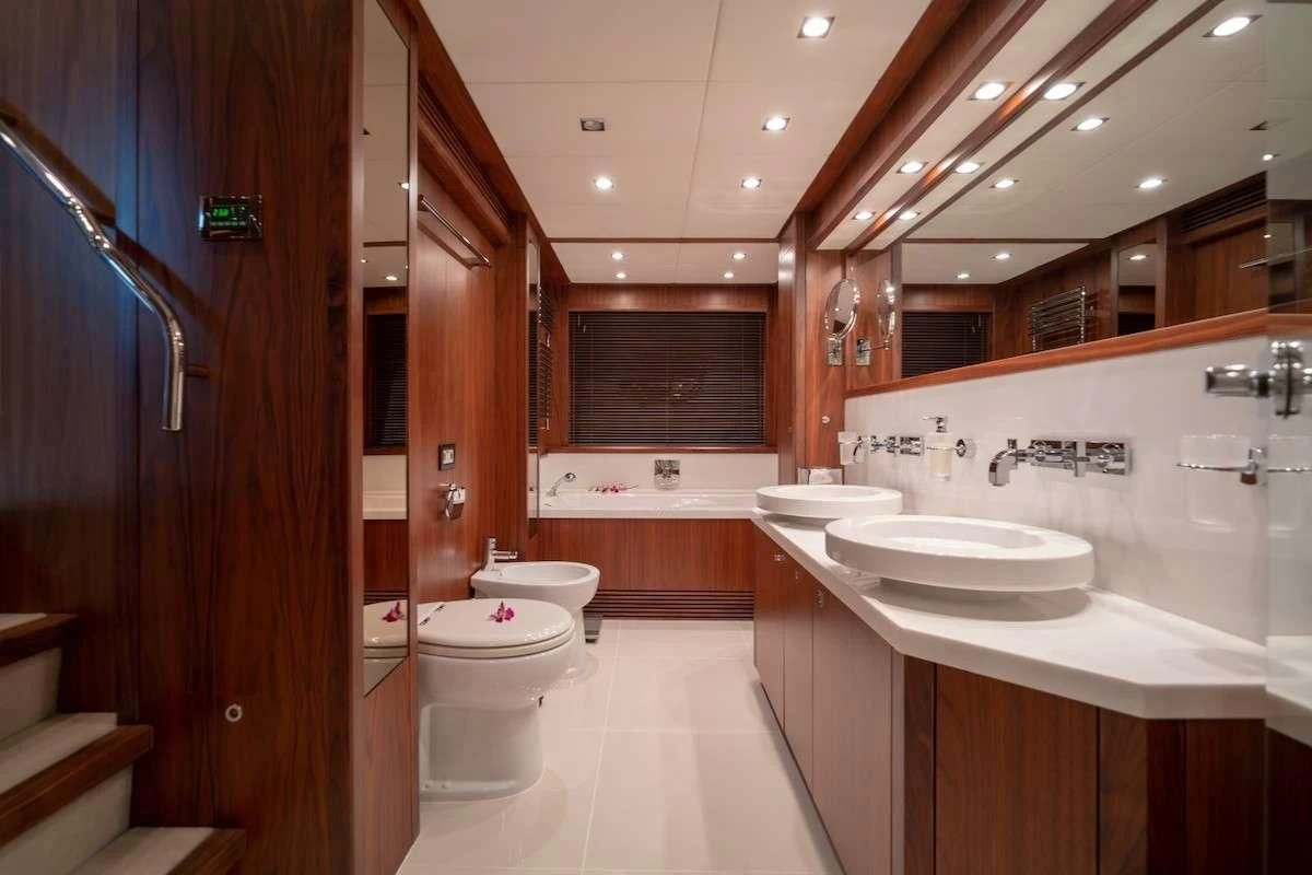 a bathroom with a sink and a toilet aboard ABOUT TIME Yacht for Sale