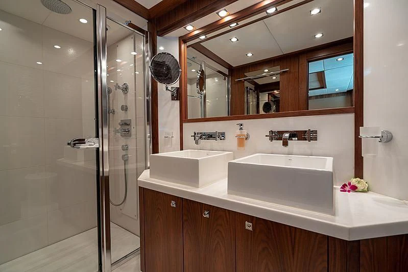 a bathroom with a large mirror aboard ABOUT TIME Yacht for Sale