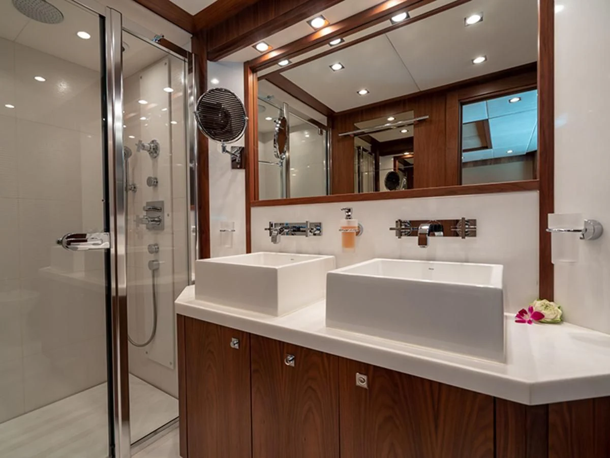 a bathroom with a shower unit and sink aboard ABOUT TIME Yacht for Sale