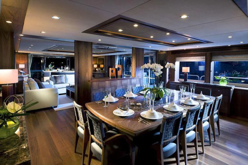 a large dining room with a table set for a meal aboard ABOUT TIME Yacht for Sale