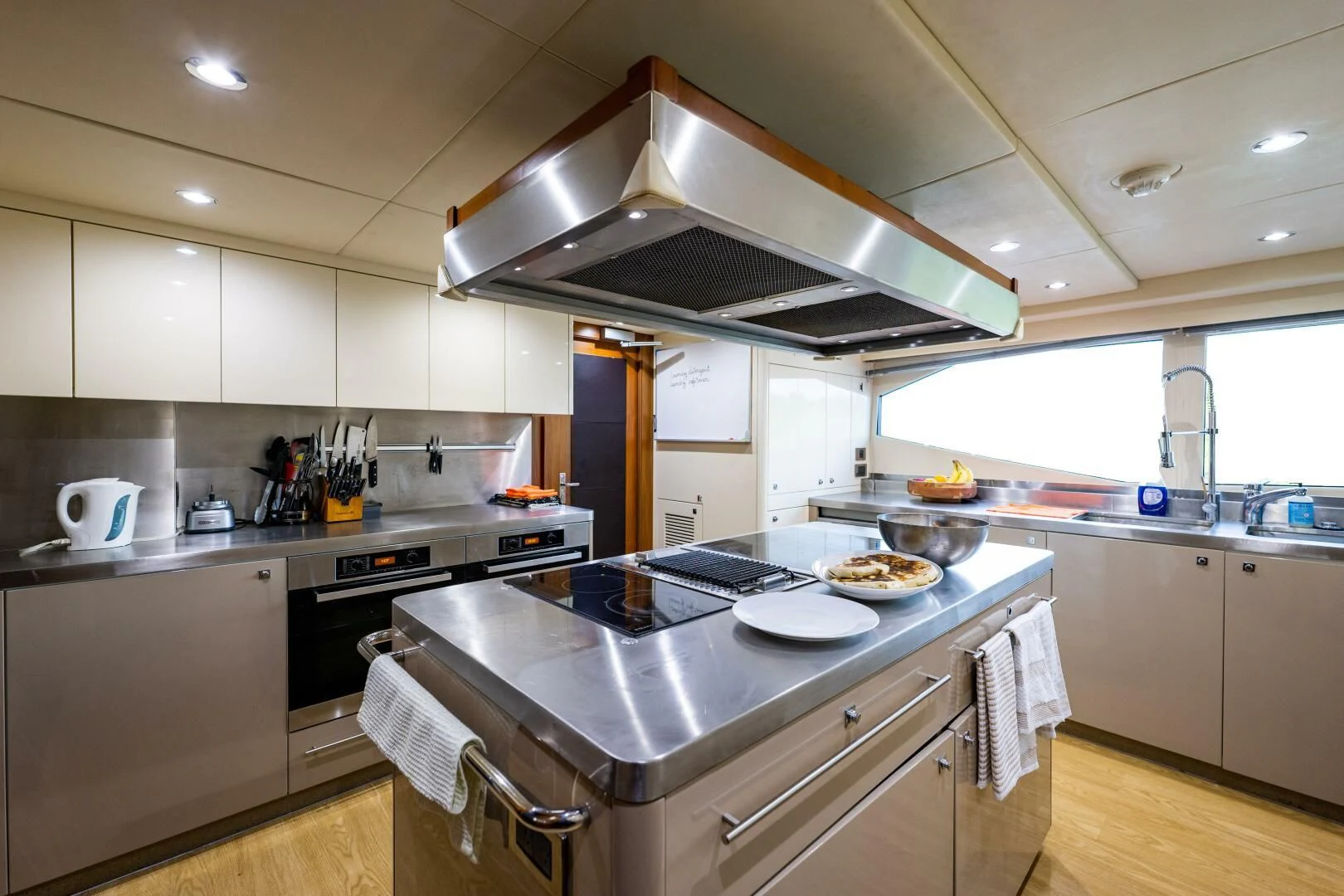 a kitchen with a stove and a sink aboard ABOUT TIME Yacht for Sale