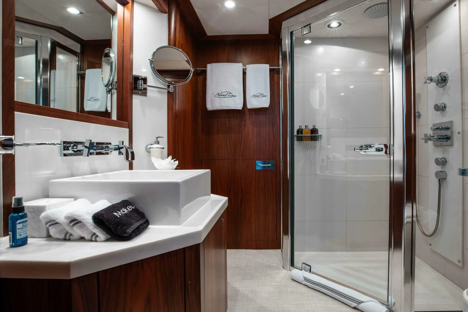 a bathroom with a shower unit and sink aboard ABOUT TIME Yacht for Sale