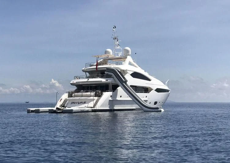 a white yacht in the water aboard ABOUT TIME Yacht for Sale