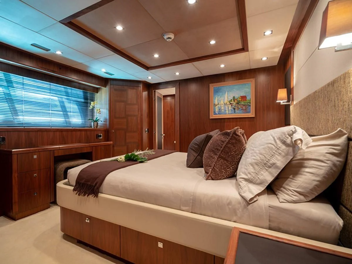 a living room with a couch and a television aboard ABOUT TIME Yacht for Sale