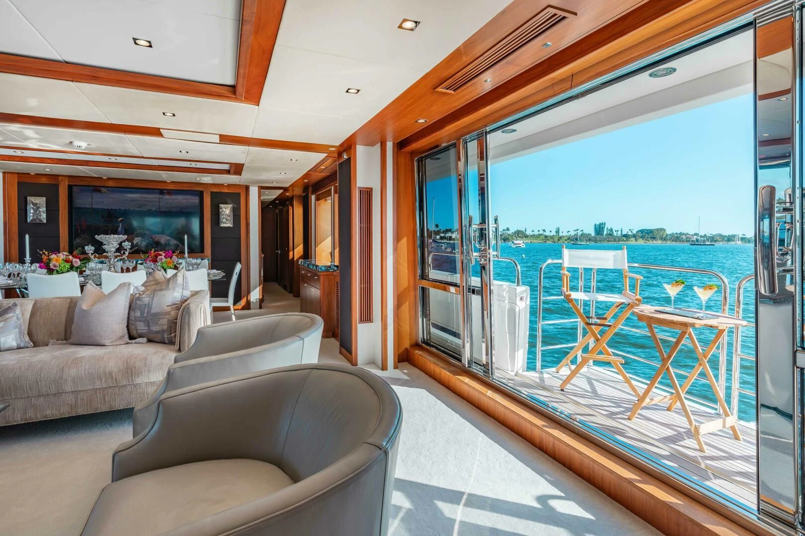a living room with a sliding glass door aboard ABOUT TIME Yacht for Sale