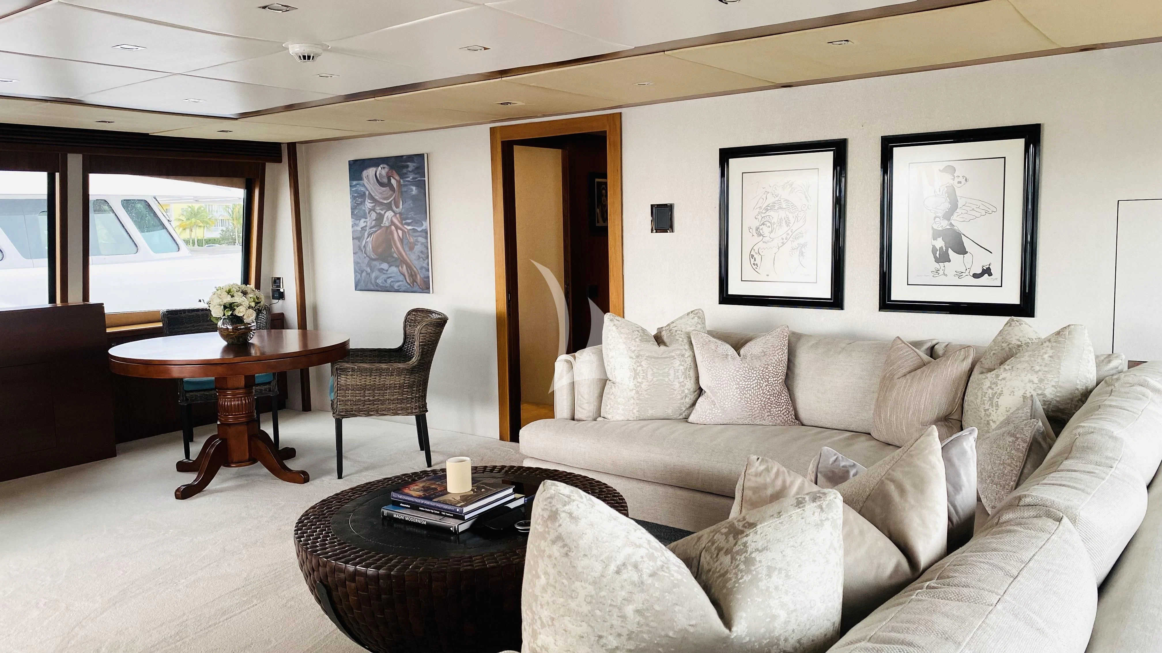a living room with a couch and a table aboard ABOUT TIME Yacht for Sale