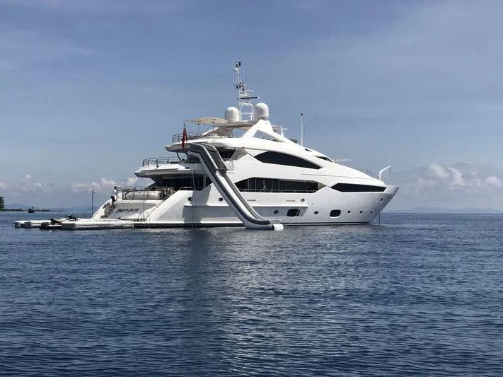 a white yacht in the water aboard ABOUT TIME Yacht for Sale