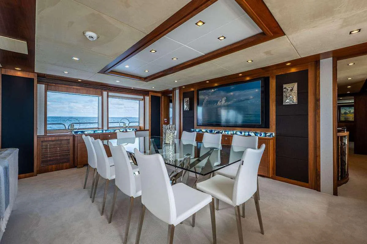 a room with tables and chairs aboard ABOUT TIME Yacht for Sale