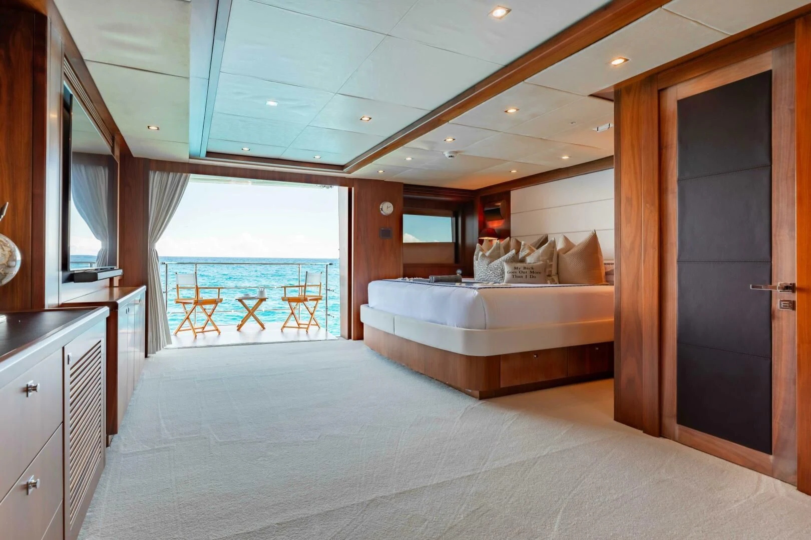 a large bedroom with a large bed aboard ABOUT TIME Yacht for Sale