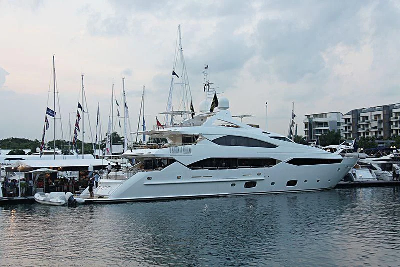 a white yacht in a harbor aboard ABOUT TIME Yacht for Sale