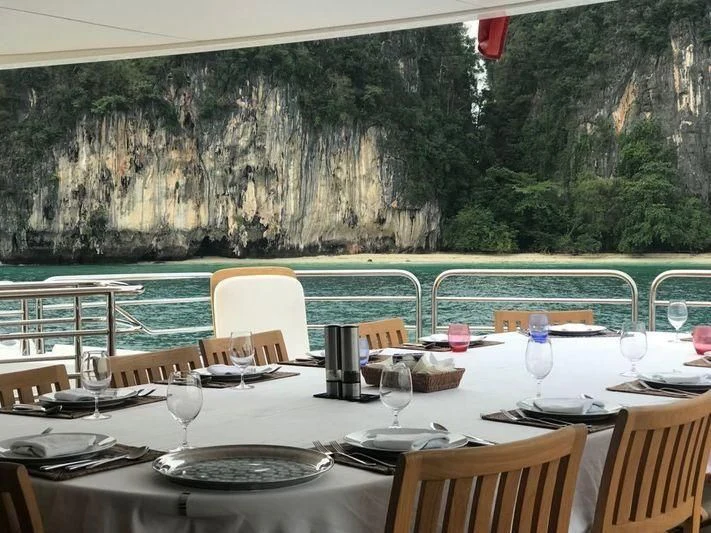 a table set for a dinner aboard ABOUT TIME Yacht for Sale