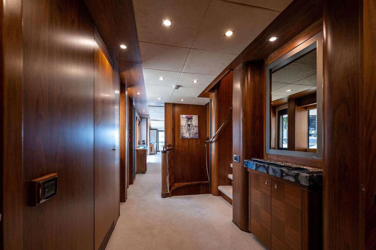 a hallway with wooden cabinets aboard ABOUT TIME Yacht for Sale