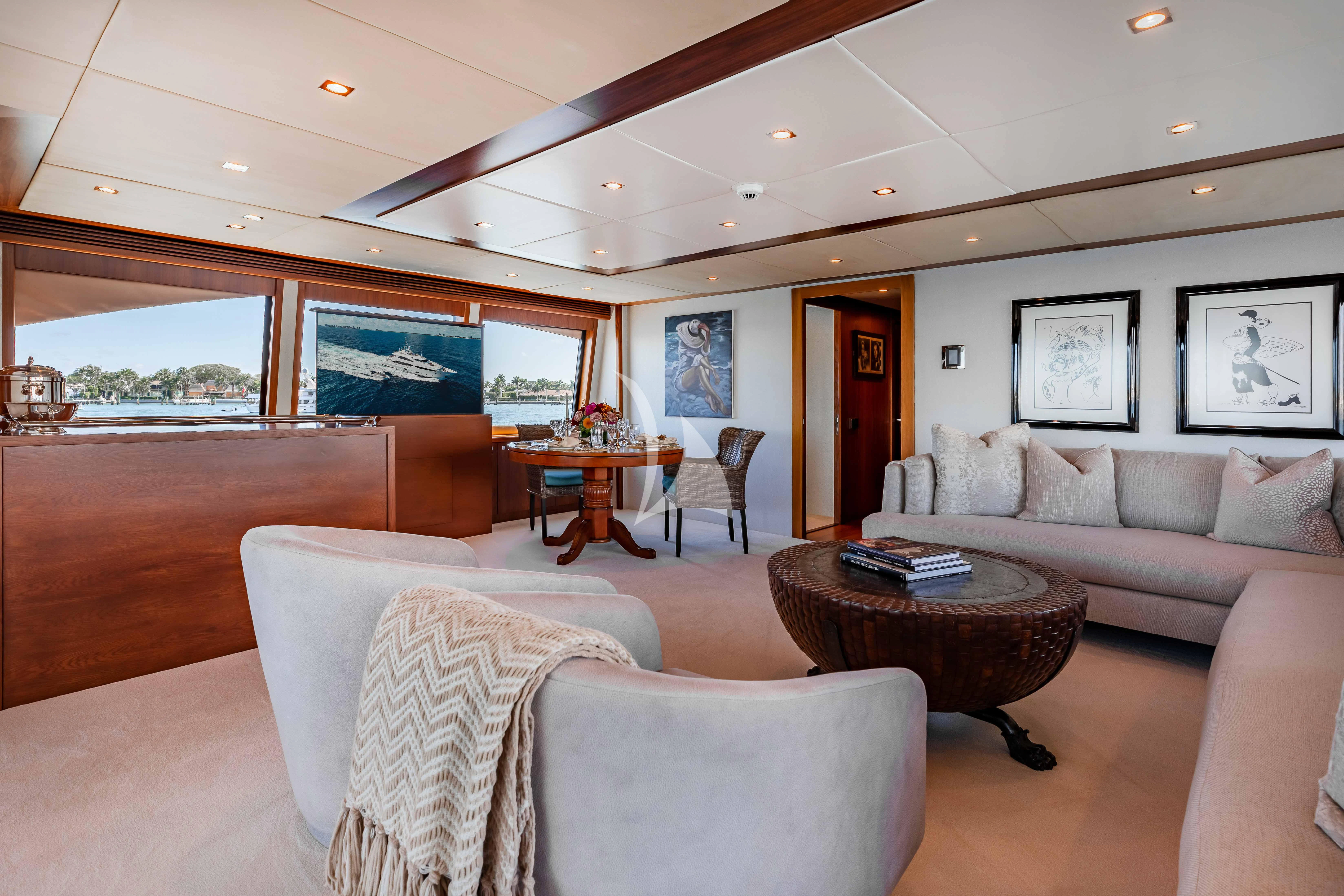 a living room with a couch and a table aboard ABOUT TIME Yacht for Sale