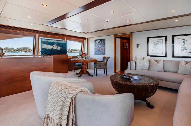 a living room with couches and a table aboard ABOUT TIME Yacht for Sale