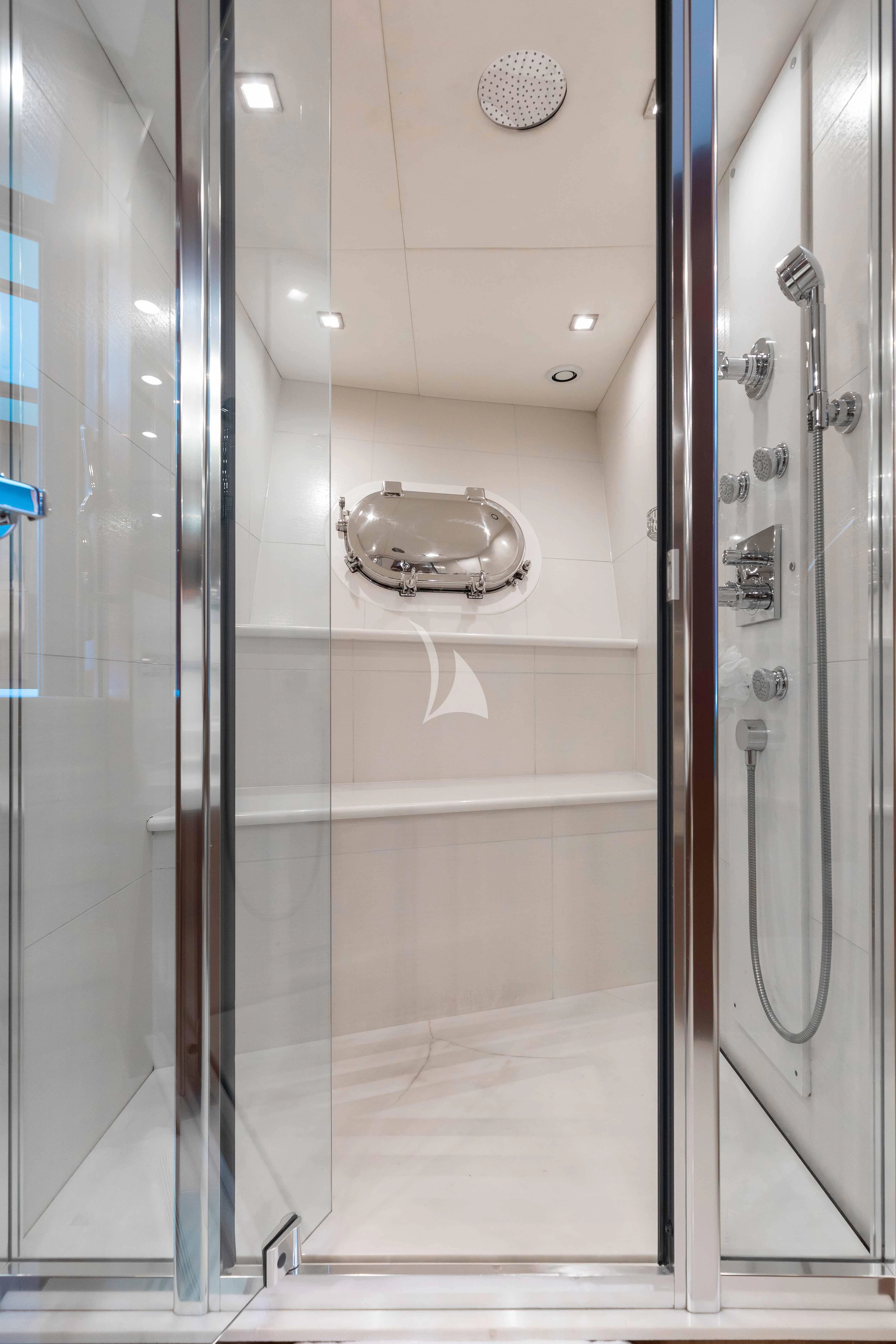 a bathroom with glass walls aboard ABOUT TIME Yacht for Sale