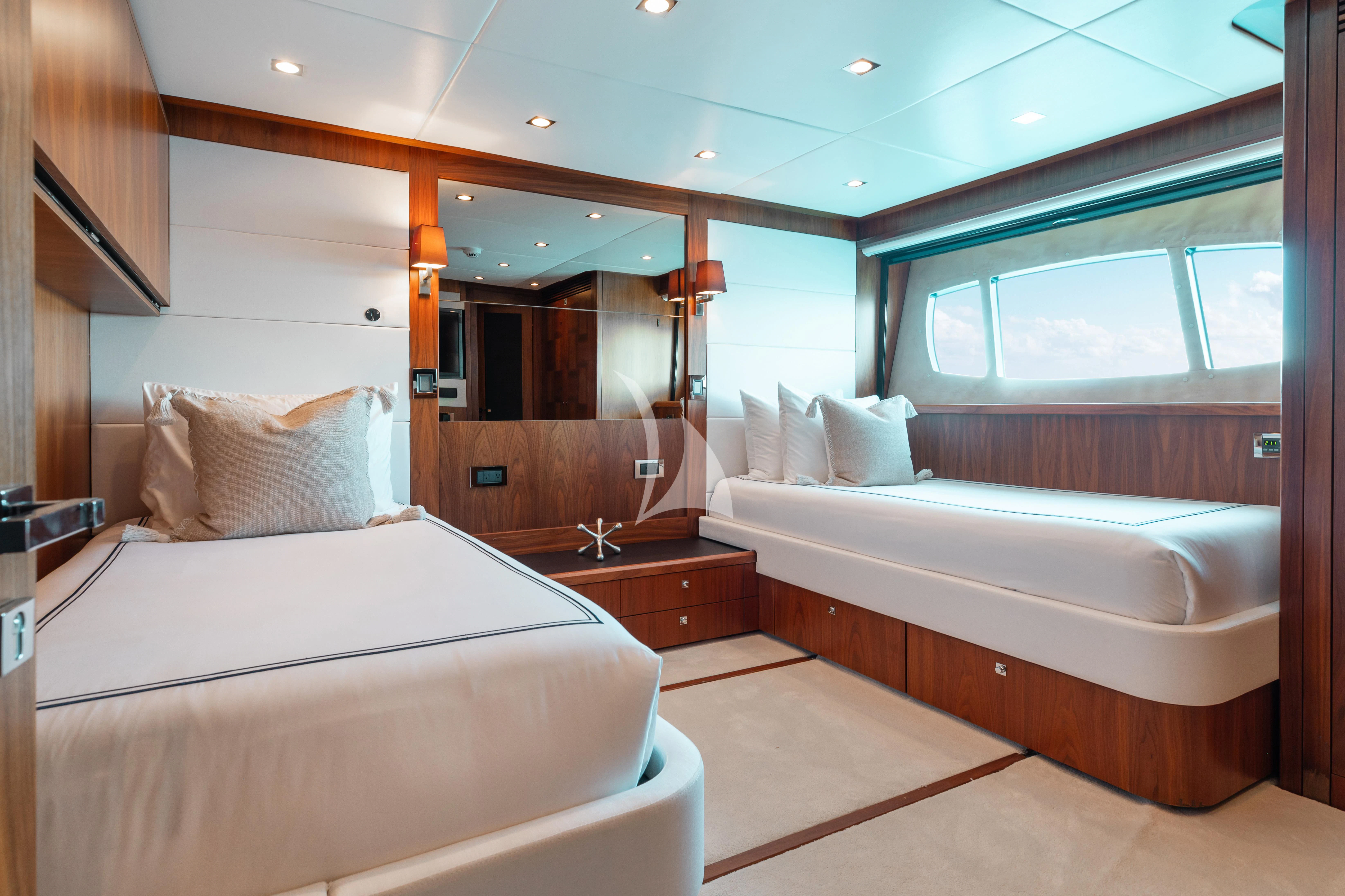 a room with two beds aboard ABOUT TIME Yacht for Sale