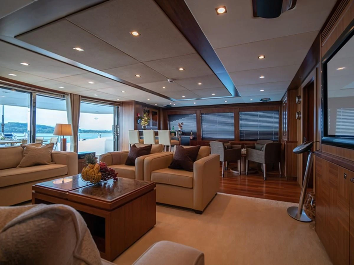 a living room with a large window aboard ABOUT TIME Yacht for Sale