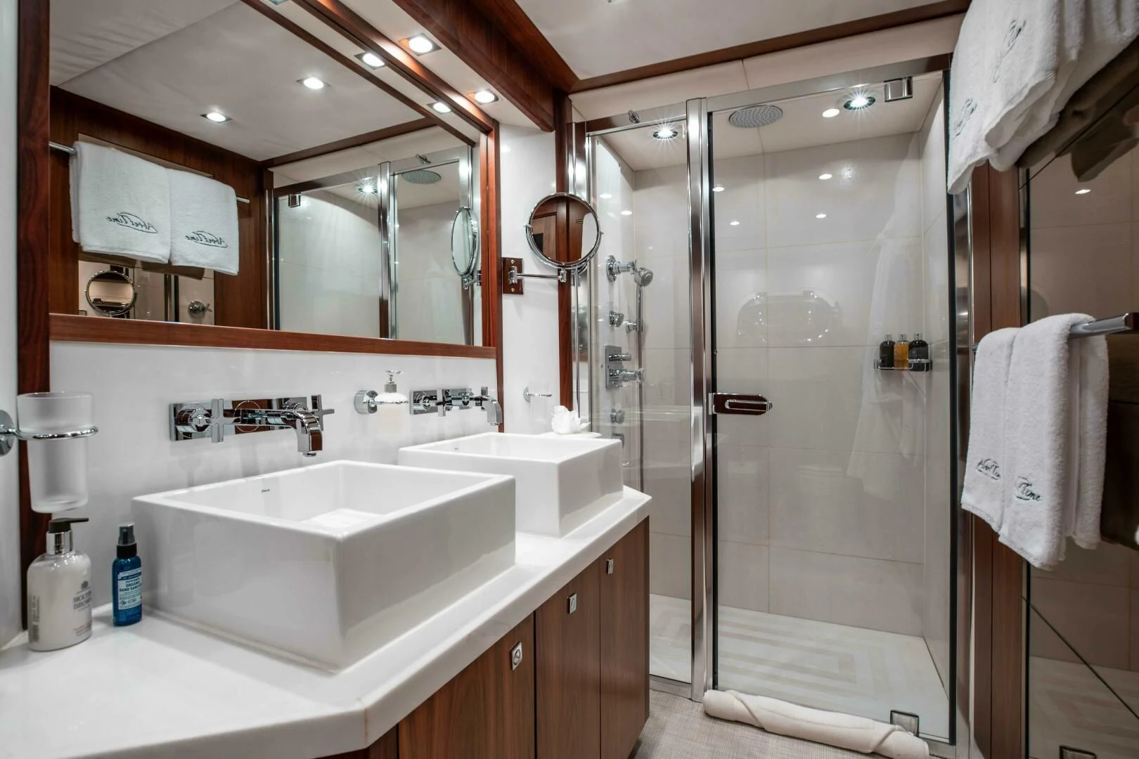 a bathroom with a glass shower aboard ABOUT TIME Yacht for Sale