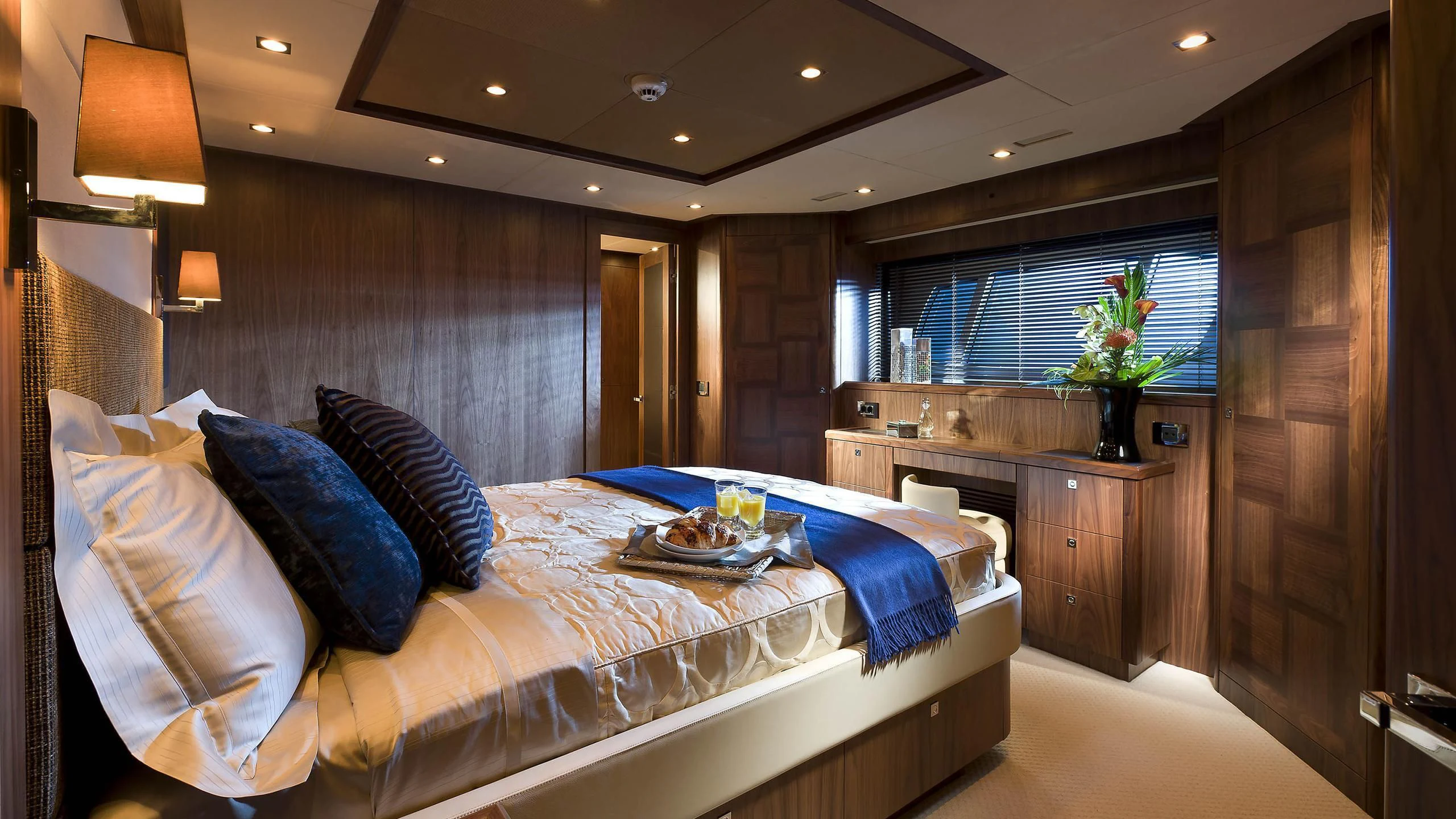 a room with a bed and a table aboard ABOUT TIME Yacht for Sale