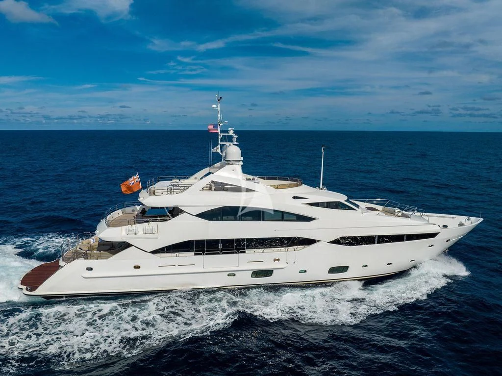 a white yacht on the water aboard ABOUT TIME Yacht for Sale