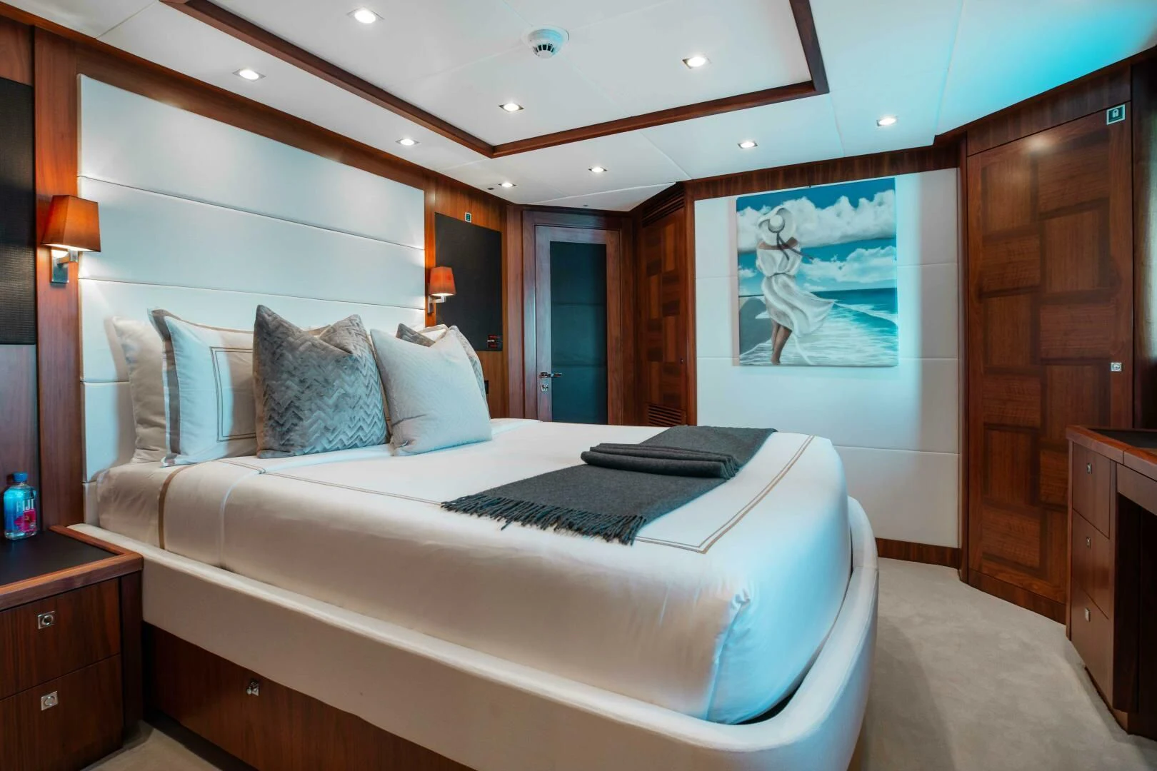 a bed with a blue pillow aboard ABOUT TIME Yacht for Sale