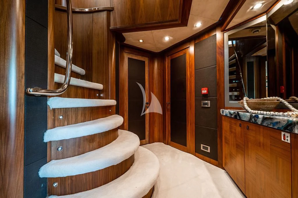 a room with a bed and a mirror aboard ABOUT TIME Yacht for Sale