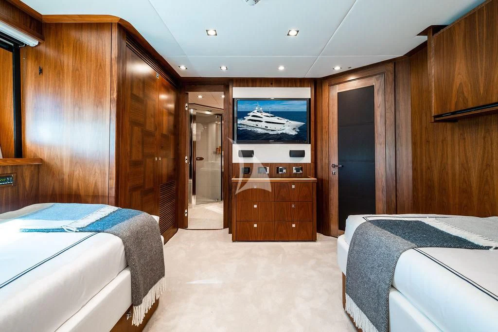 a room with a bed and a television aboard ABOUT TIME Yacht for Sale