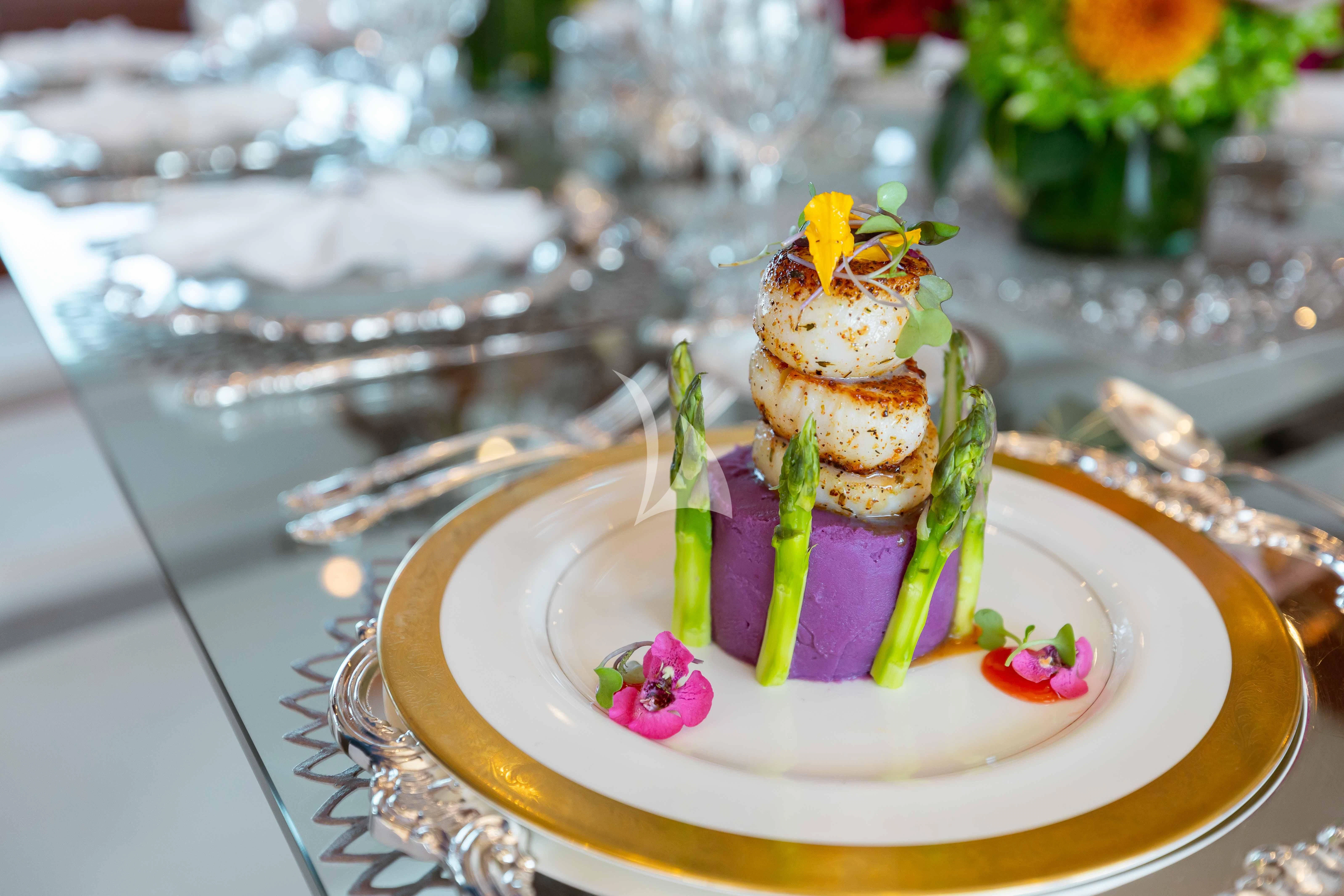 a cake on a plate aboard ABOUT TIME Yacht for Sale