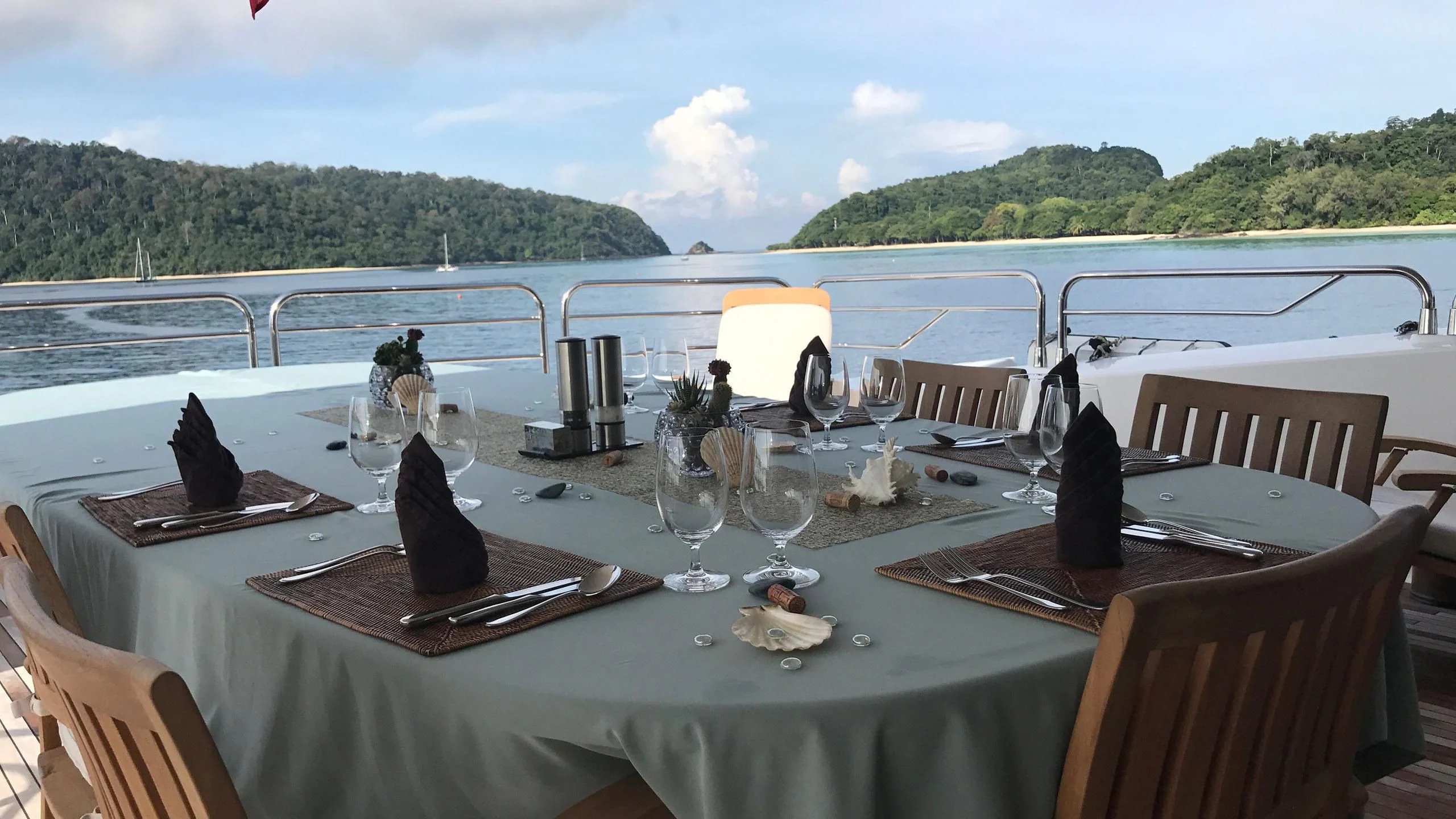 a table set for a dinner aboard ABOUT TIME Yacht for Sale