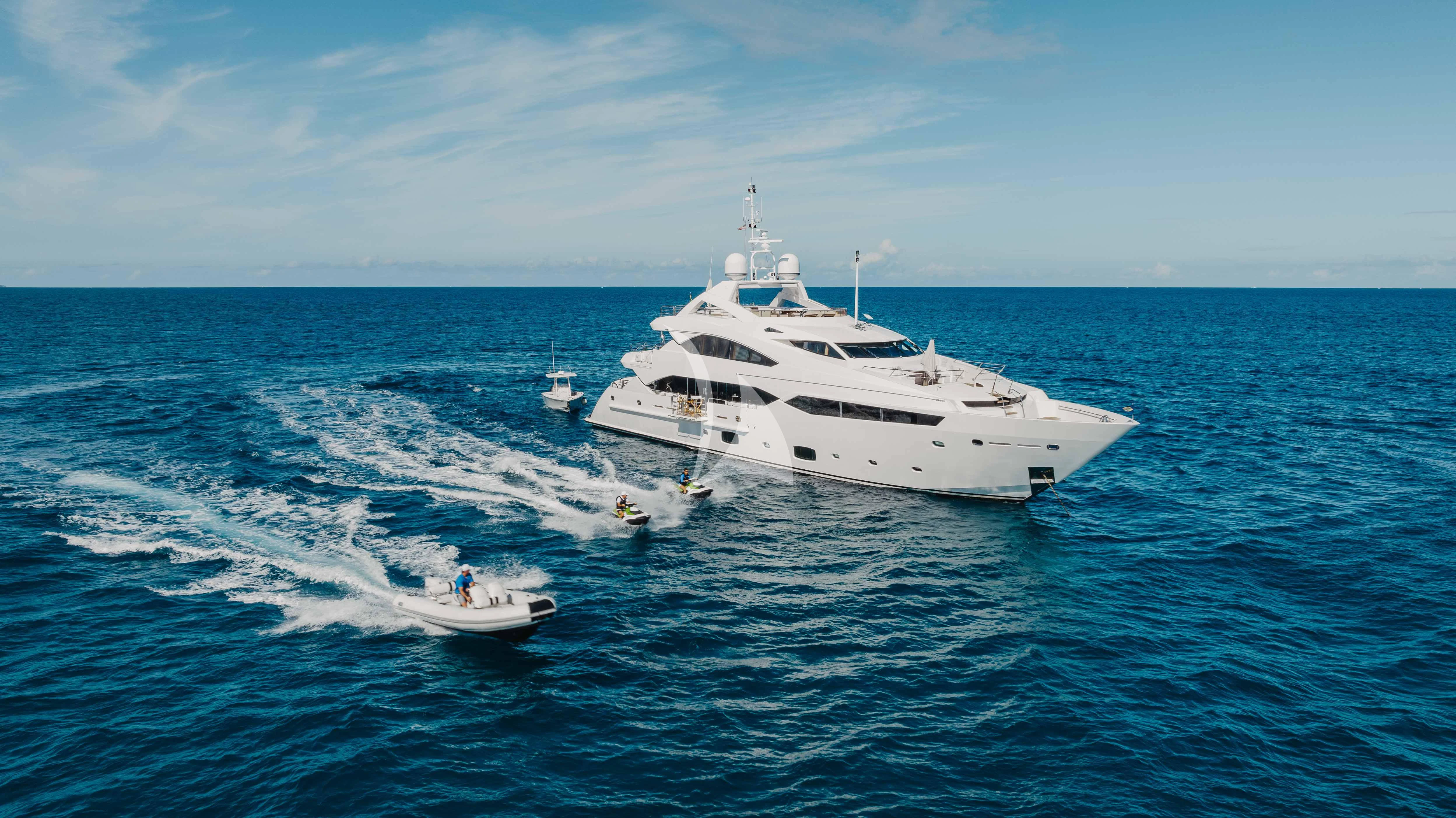 a white yacht on the water aboard ABOUT TIME Yacht for Sale