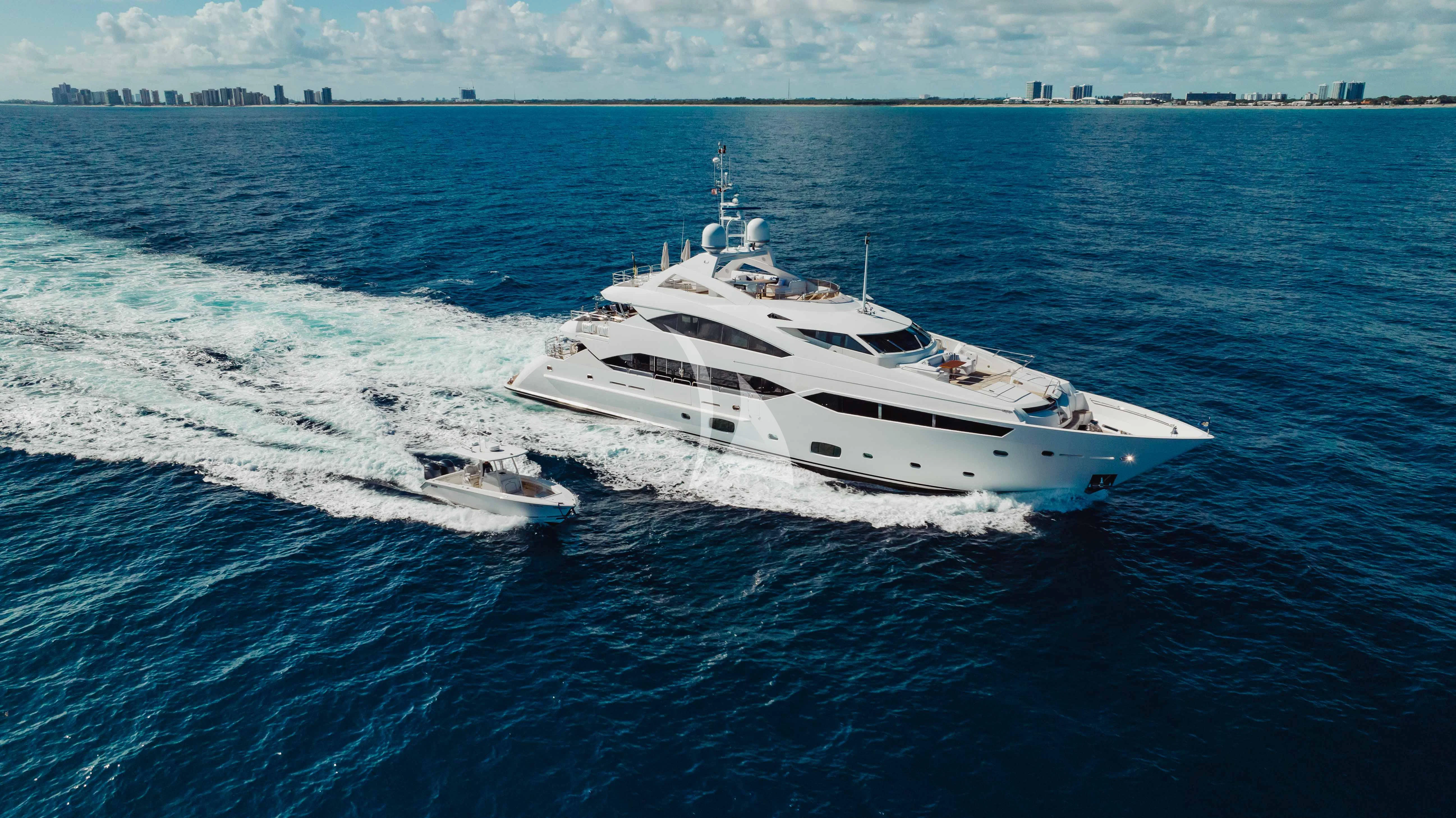 a white yacht on the water aboard ABOUT TIME Yacht for Sale