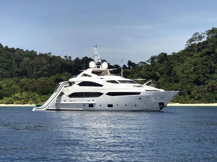 a white yacht on the water aboard ABOUT TIME Yacht for Sale