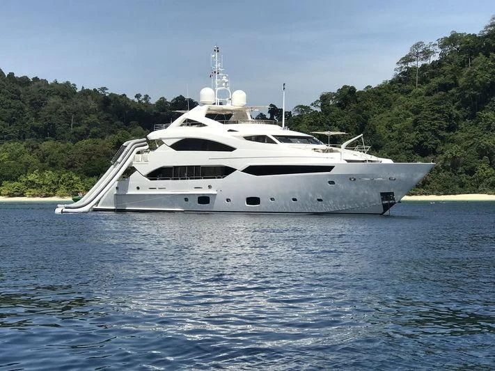 a white yacht on the water aboard ABOUT TIME Yacht for Sale