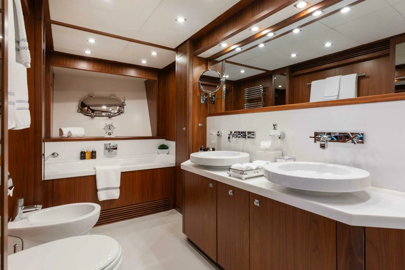 a bathroom with a sink and a mirror aboard ABOUT TIME Yacht for Sale