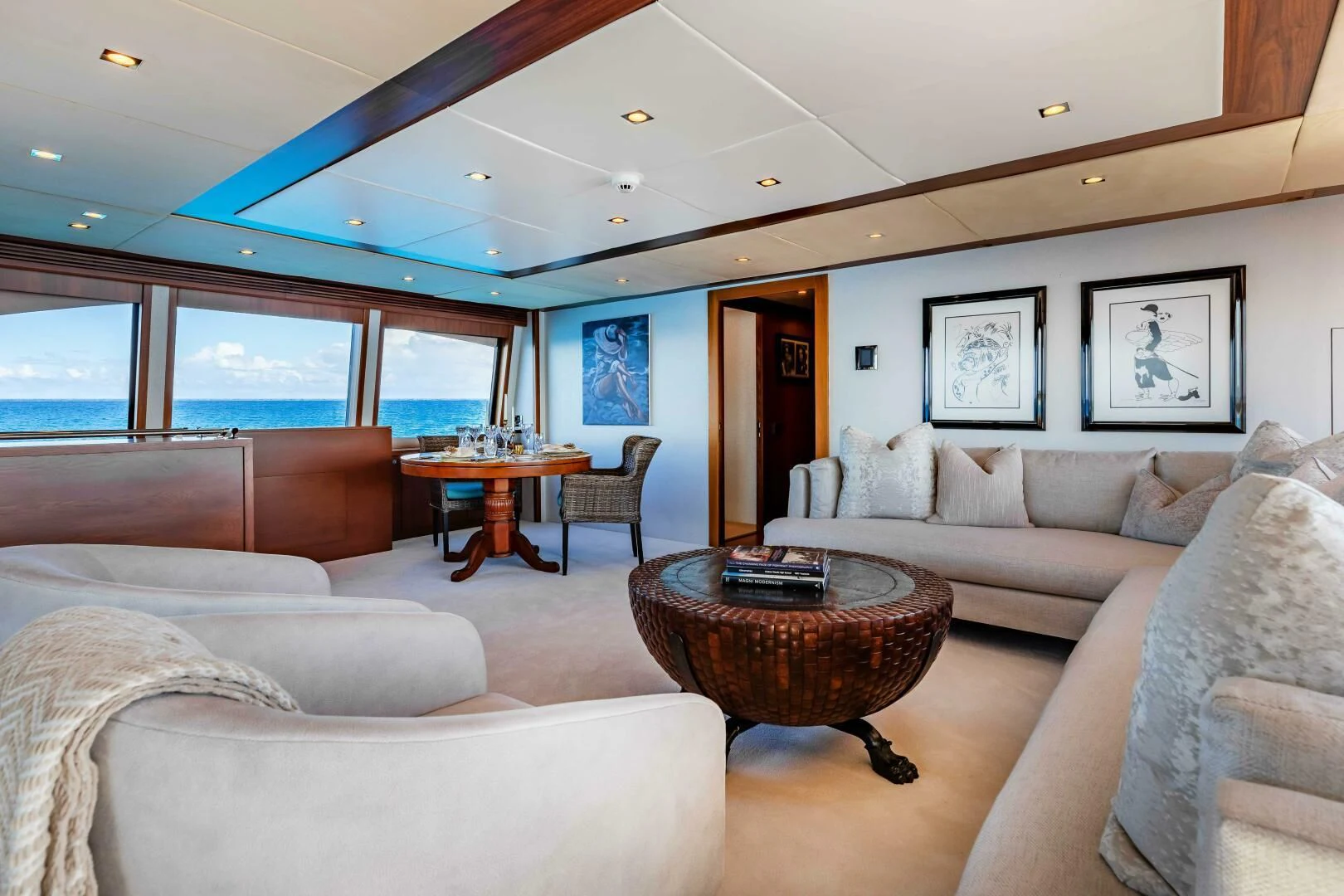 a living room with couches and a table aboard ABOUT TIME Yacht for Sale