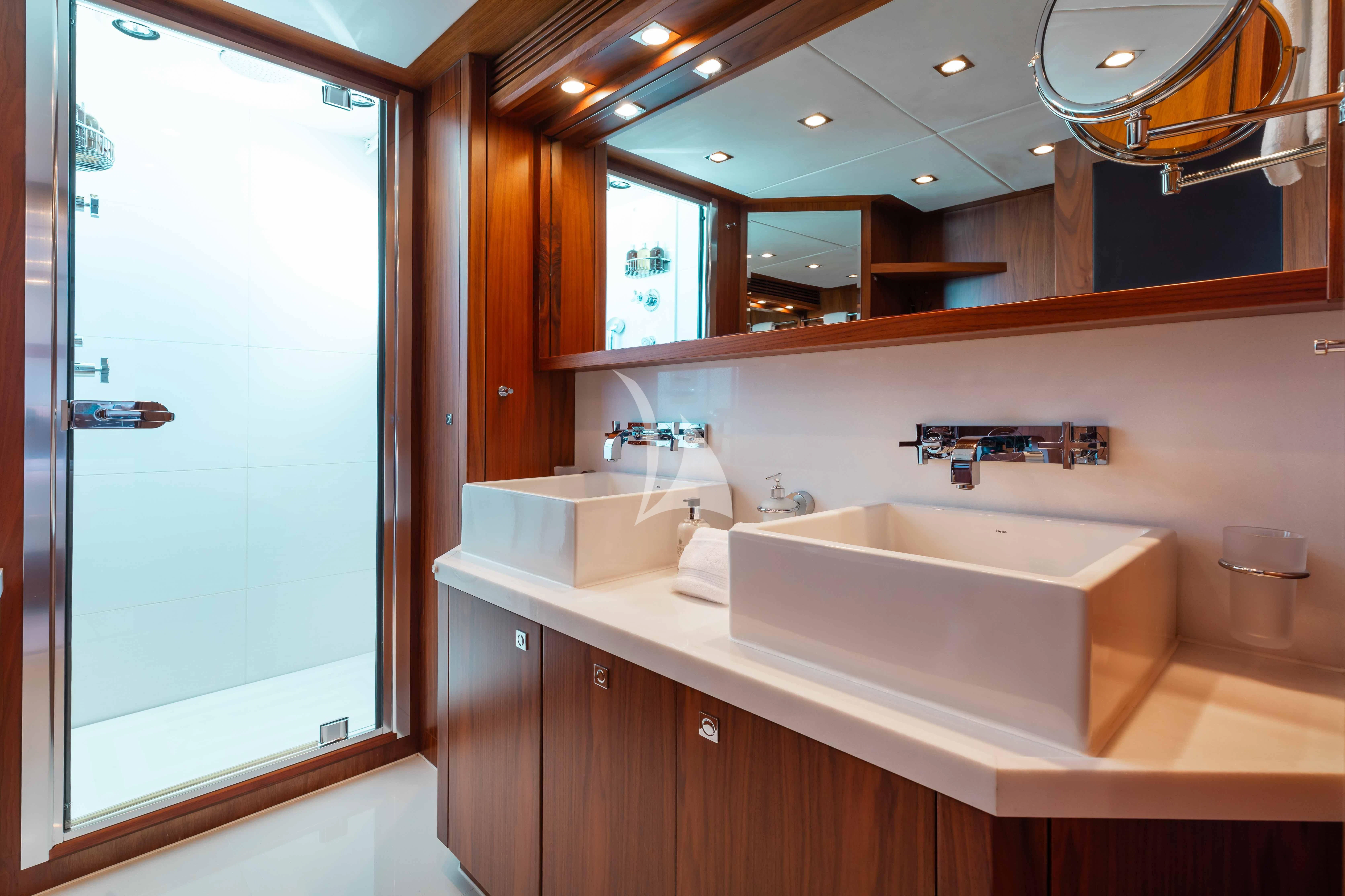 a bathroom with a large mirror aboard ABOUT TIME Yacht for Sale