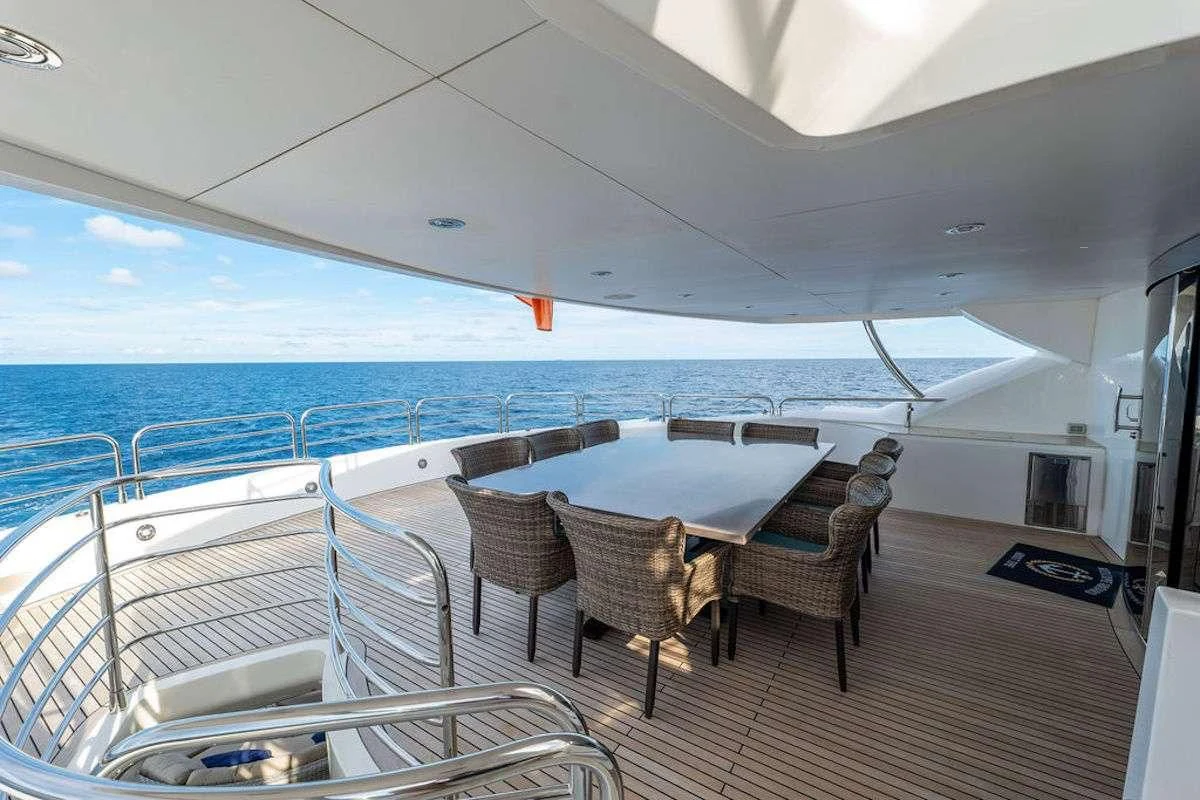 a large white tent with chairs and tables on it aboard ABOUT TIME Yacht for Sale