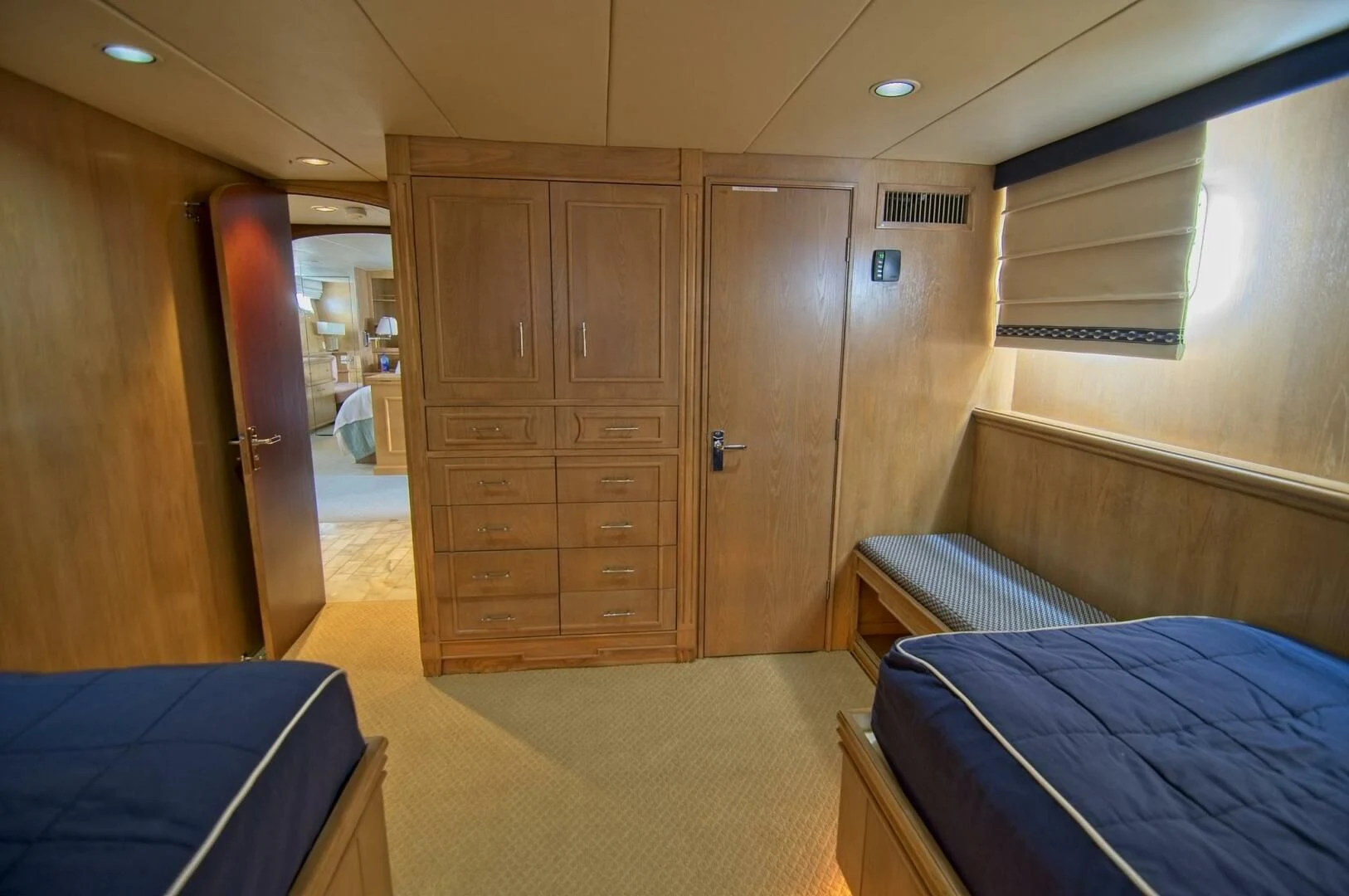 a room with a bed and a closet aboard VICTORY Yacht for Sale