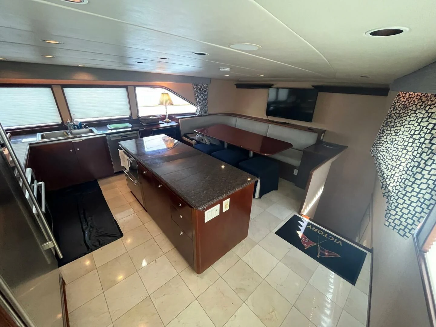 a room with a bed and a desk aboard VICTORY Yacht for Sale