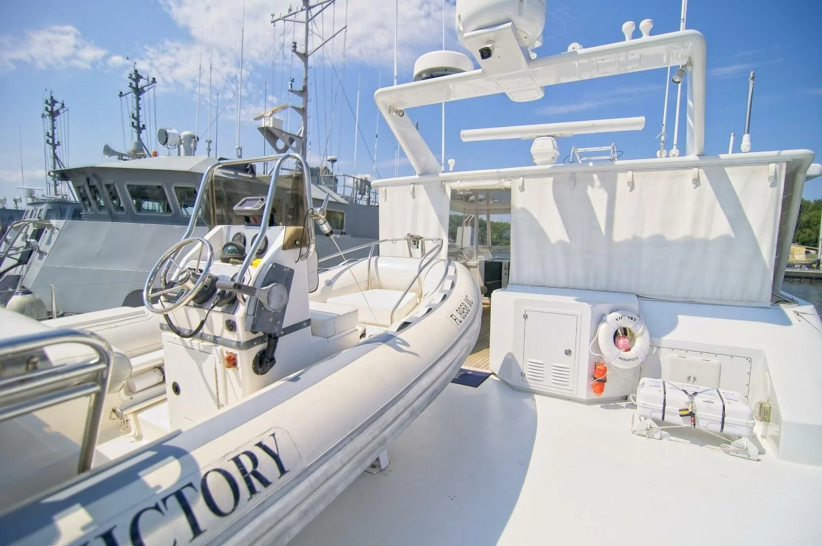 a group of boats on a white surface aboard VICTORY Yacht for Sale