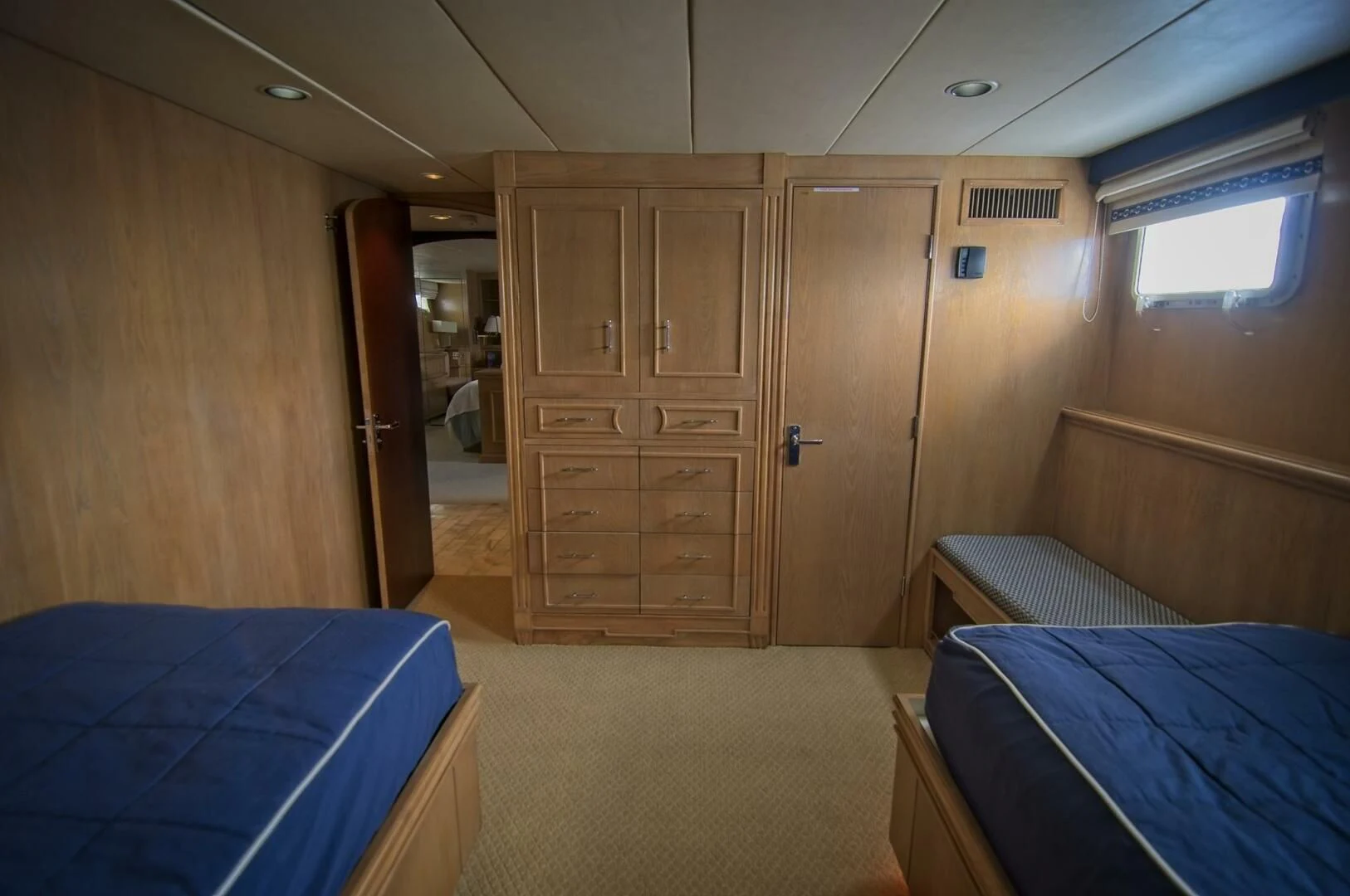a room with a bed and a closet aboard VICTORY Yacht for Sale