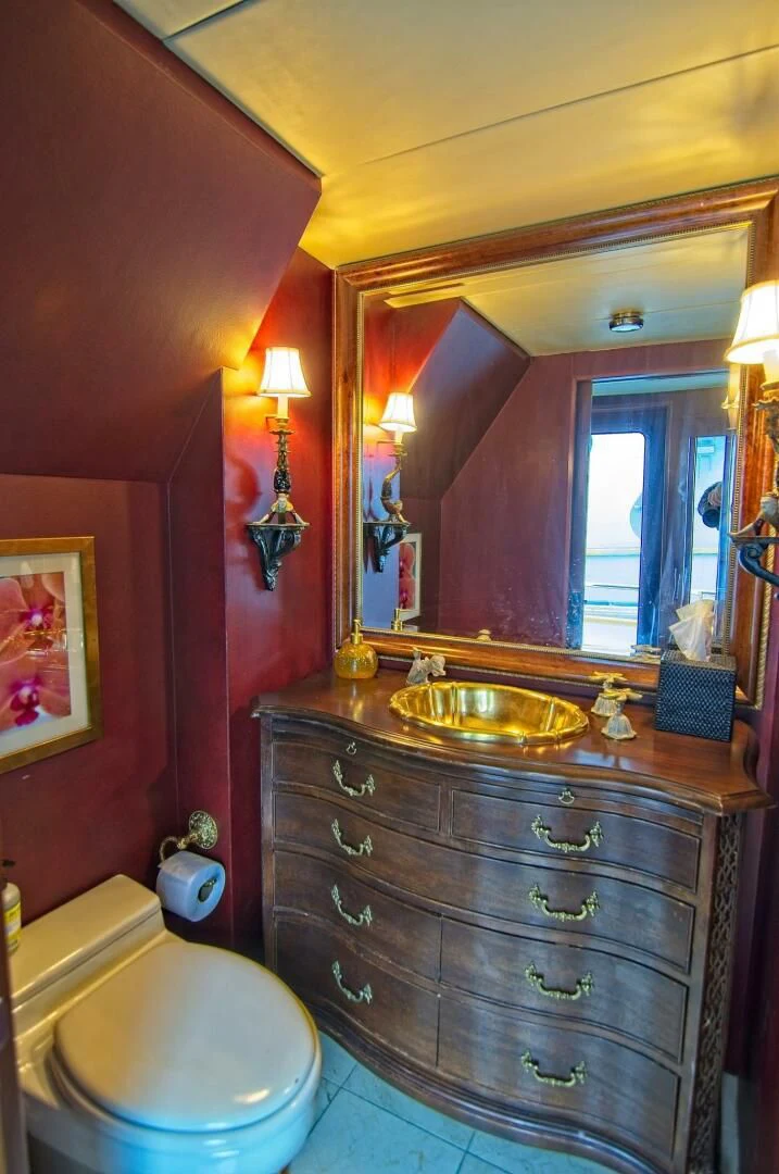 a bathroom with a sink and a toilet aboard VICTORY Yacht for Sale