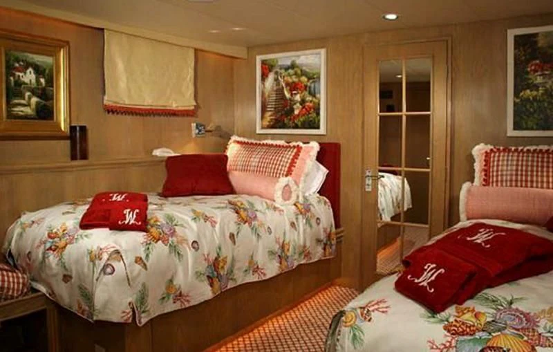 a room with beds and pillows aboard VICTORY Yacht for Sale