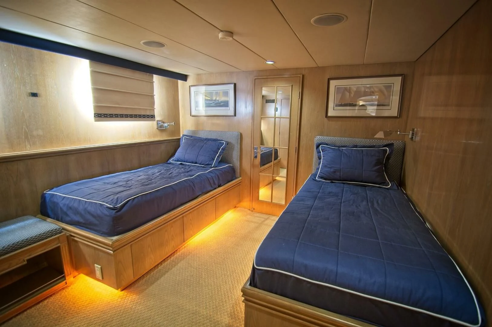 a room with a bed and a couch aboard VICTORY Yacht for Sale