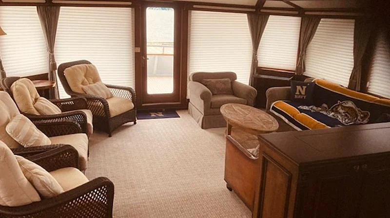 a living room with a couch and a chair aboard VICTORY Yacht for Sale