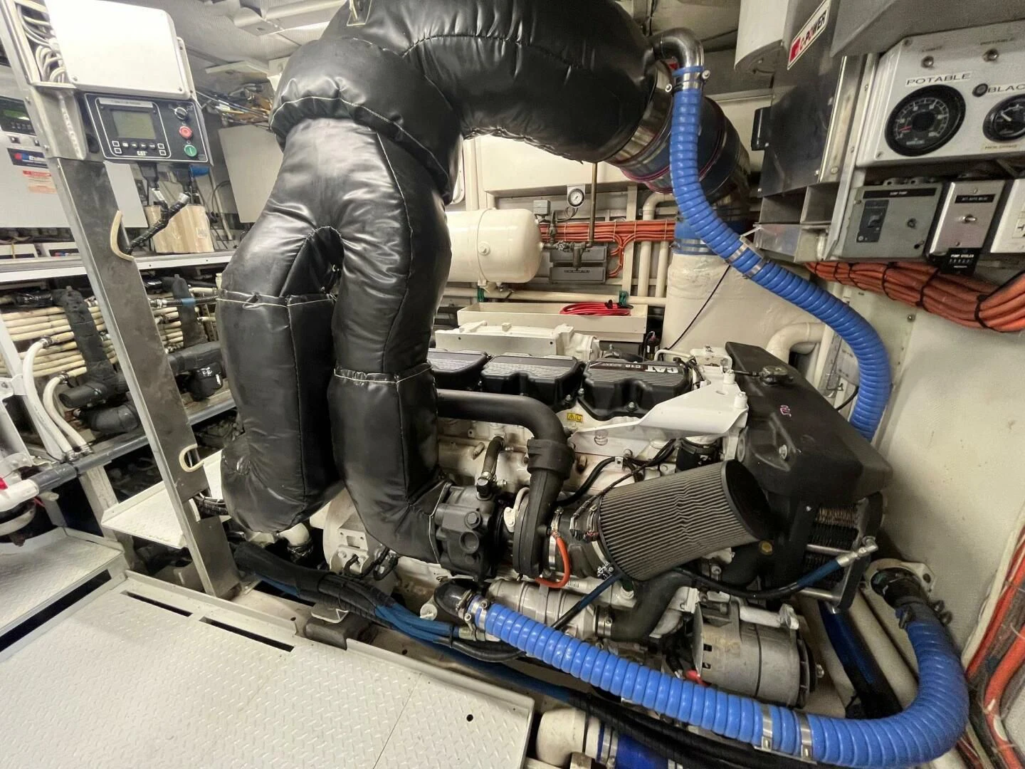 a person working on a machine aboard VICTORY Yacht for Sale