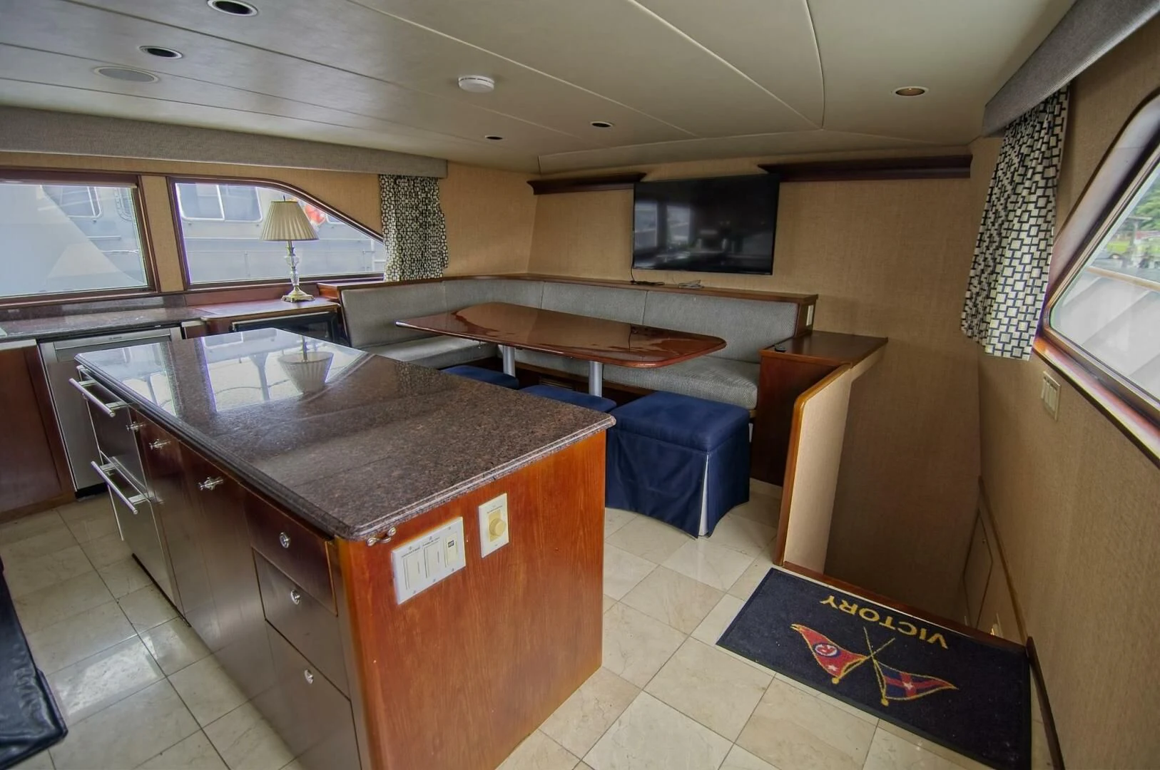 a room with a bed and a desk aboard VICTORY Yacht for Sale
