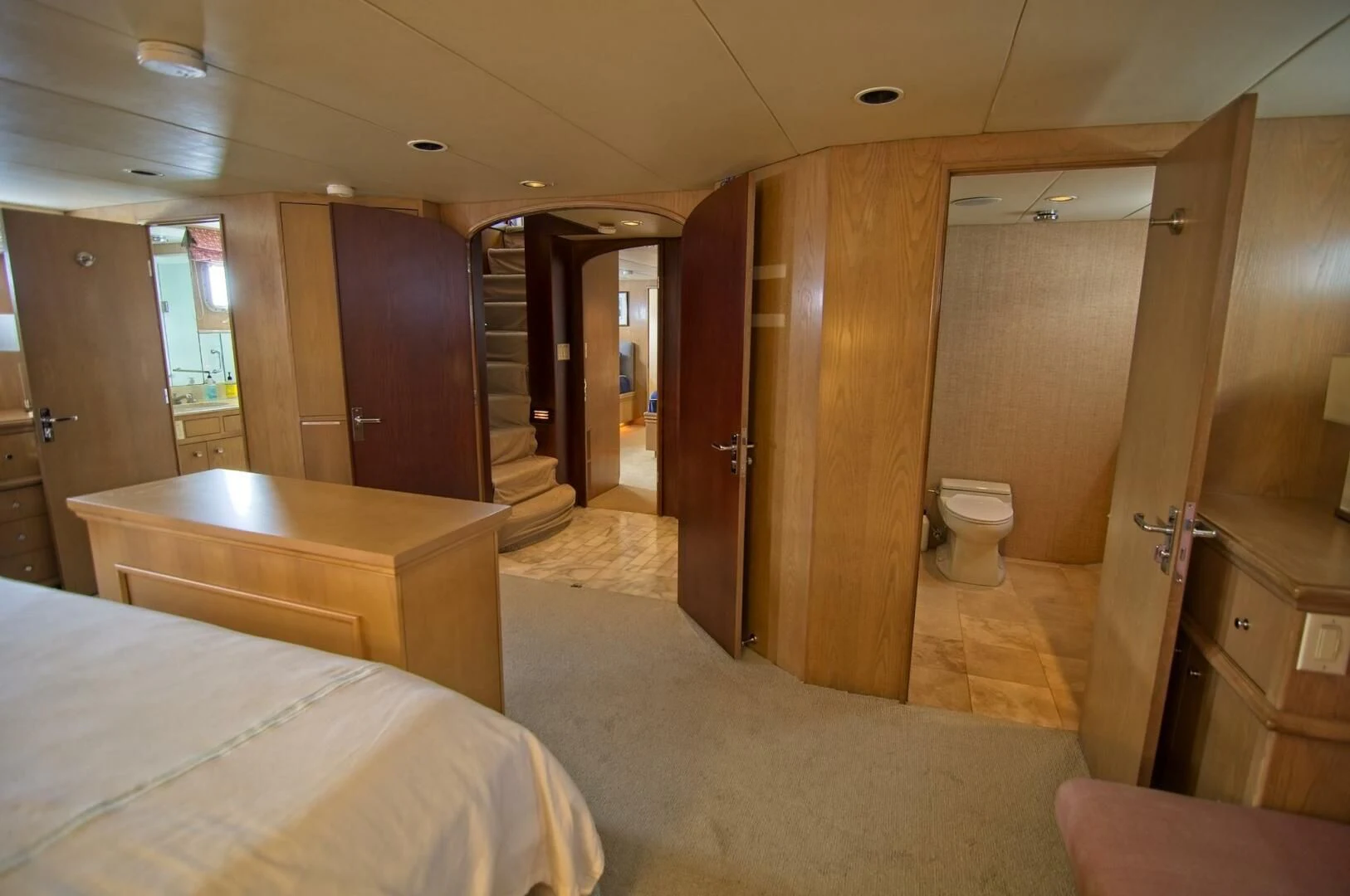 a hotel room with a bed and a large closet aboard VICTORY Yacht for Sale