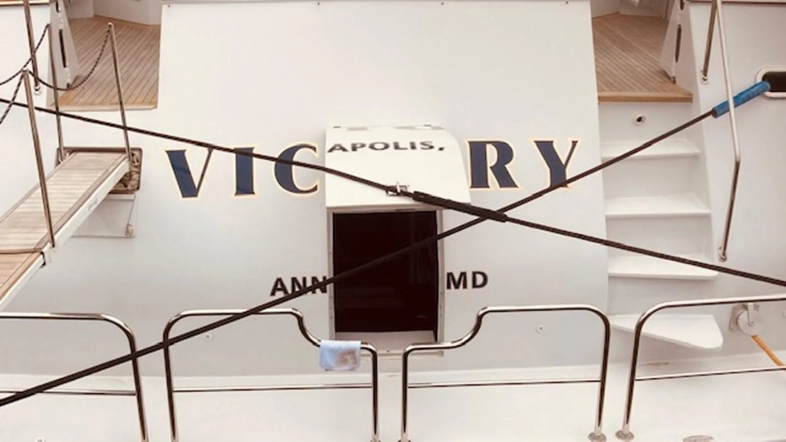 a white board with a black and blue logo on it aboard VICTORY Yacht for Sale