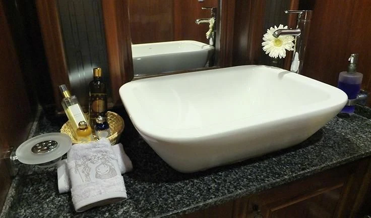 a bathroom with a bathtub and sink aboard KAPTAN MEHMET BUGRA Yacht for Sale